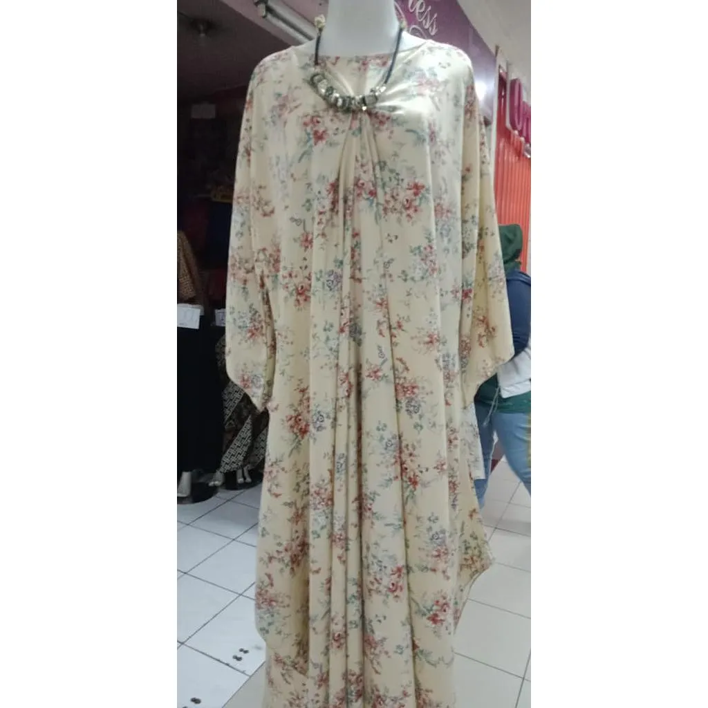 Gamis dari campuran polyester dan spandek, menawarkan kenyamanan dan keanggunan.