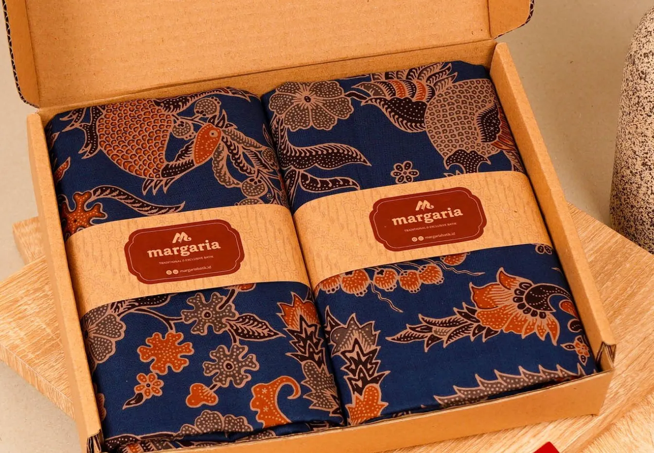 Traditional Eid hampers with premium batik scarves and custom fabric wrapping.