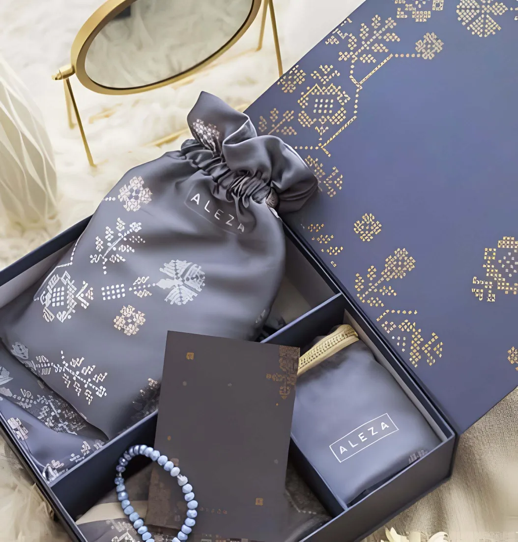 Eid prayer hampers with personalized prayer rugs, tasbih, and calendars.