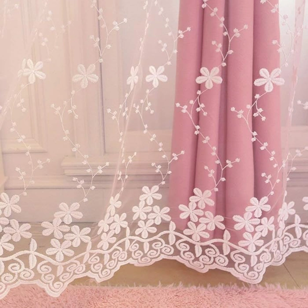 Elegant window curtains enhanced with fine laser-cut patterns, allowing decorative light play and adding a stylish touch to interiors
