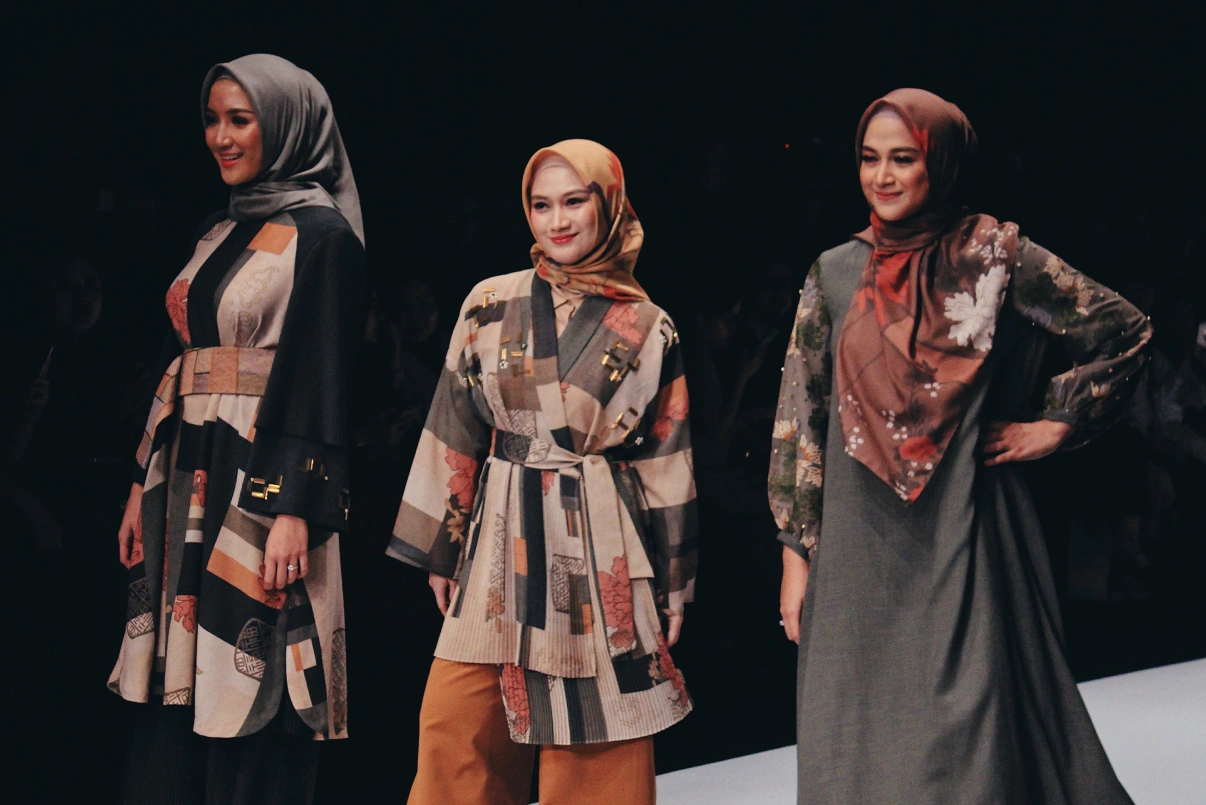Hijab fashion show promotion featuring diverse models, Indonesian elements, and exclusive collections.