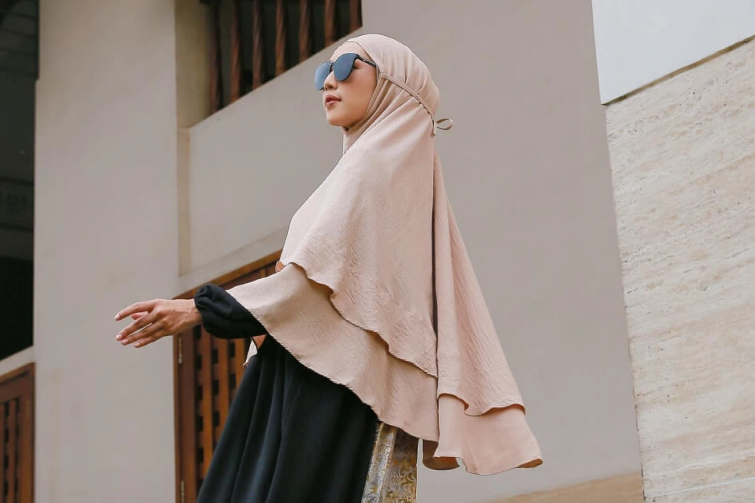 Bergo hijab style with built-in inner cap, favored by youth for its convenience and comfort in daily routines.