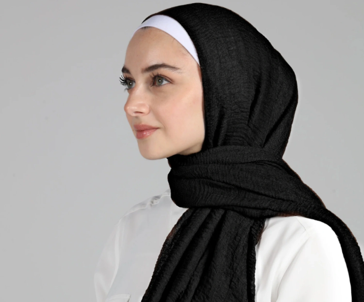 Crinkle hijab style favored by youth for its low maintenance, textured look, and everyday practicality.