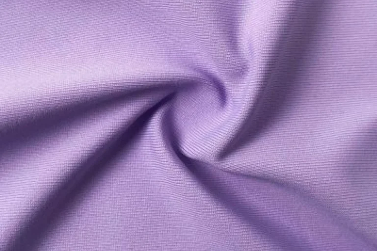 Nylon jersey fabric featuring a smooth, durable texture, ideal for activewear and sports apparel with moisture-wicking properties
