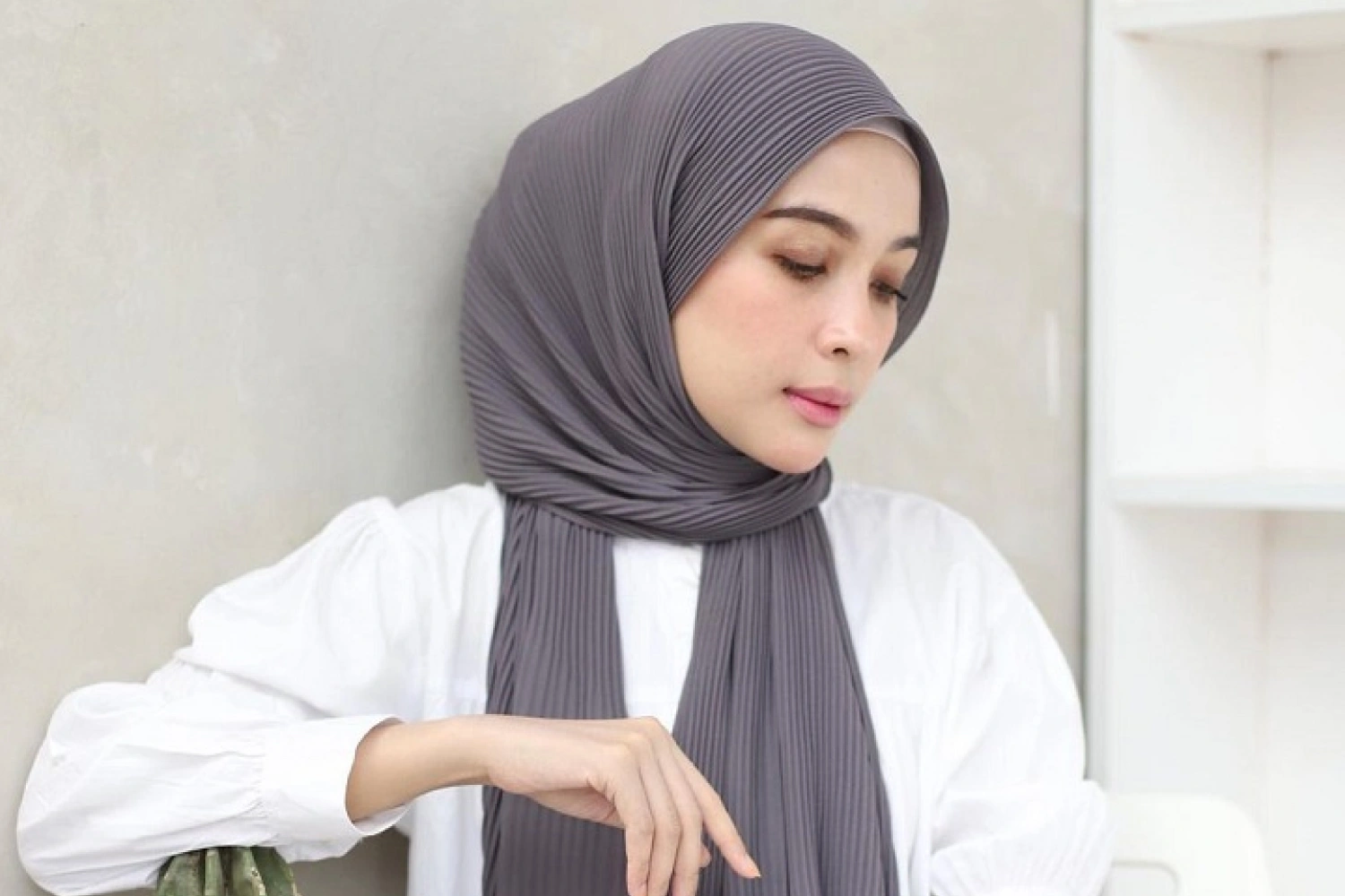 Pleated hijab style with permanent folds, loved by youth for easy maintenance and elegant modern look.