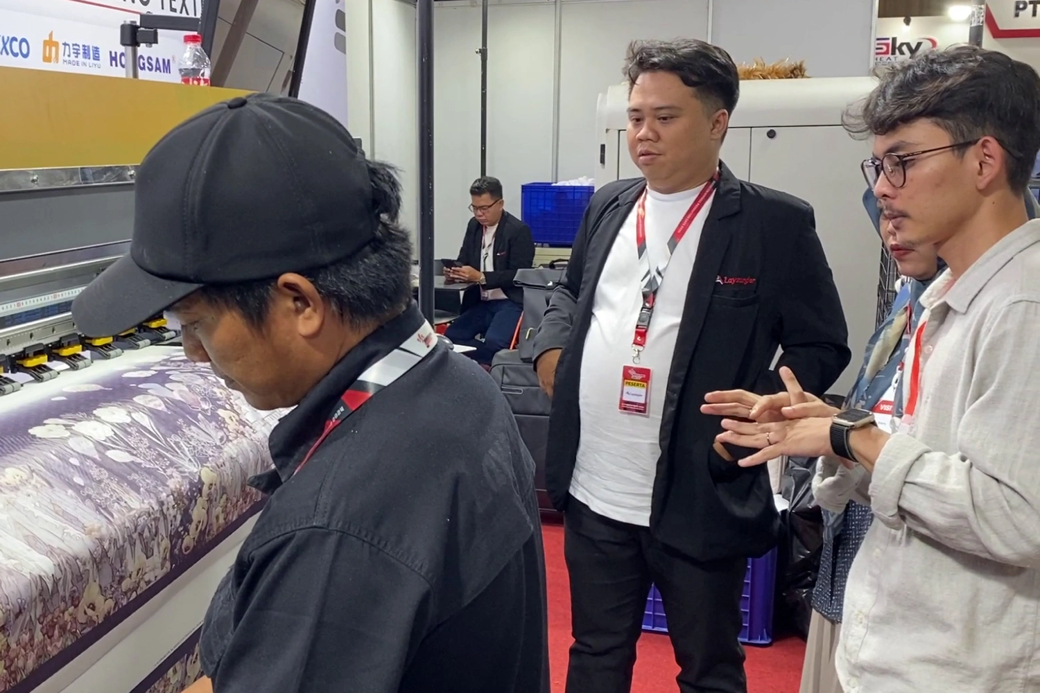 Technician speaking with a visitor