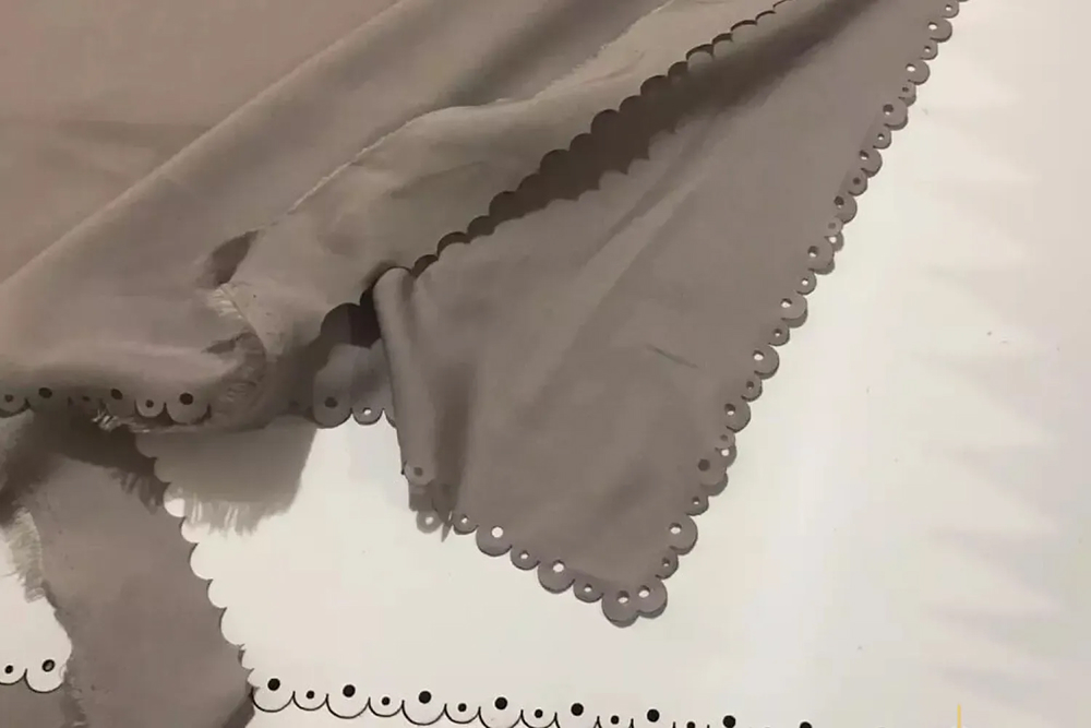 Laser cutter producing smooth, sealed fabric edges that prevent fraying and ensure a professional finish on textile products