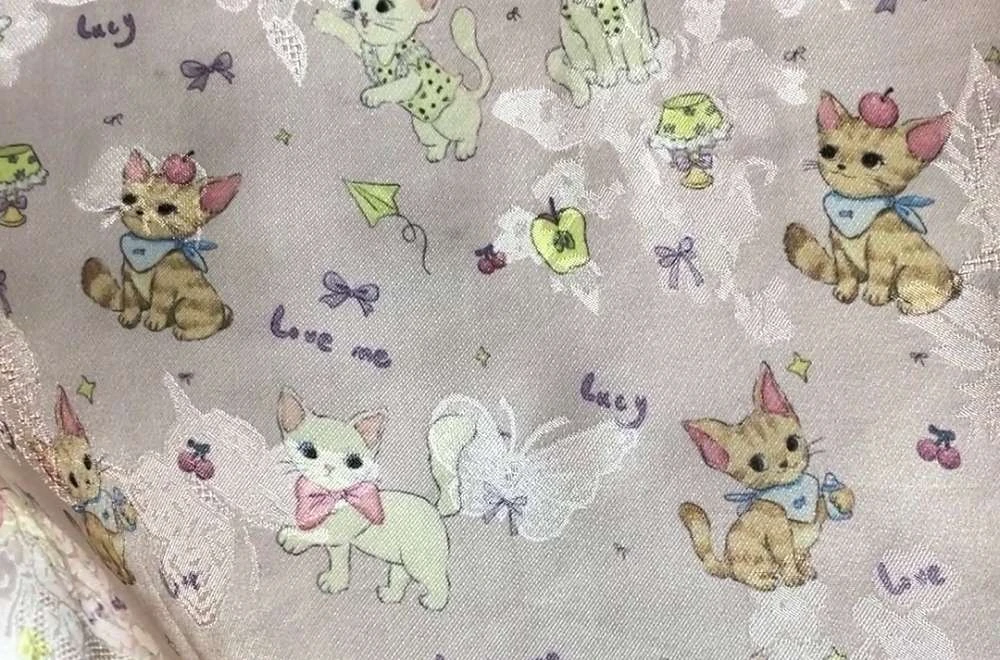 Hasil test print pada kain dengan detail motif kucing dan warna lembut di pameran IAPE Bandung 2026